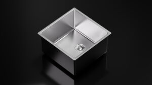 a square silver sink with a drain